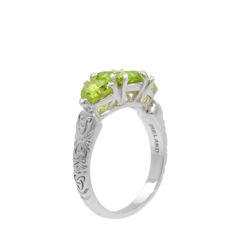 celtic ring - three stone peridot with celtic knotwork ring