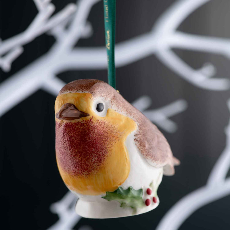 Decorative Belleek Robin ornament with a black background
