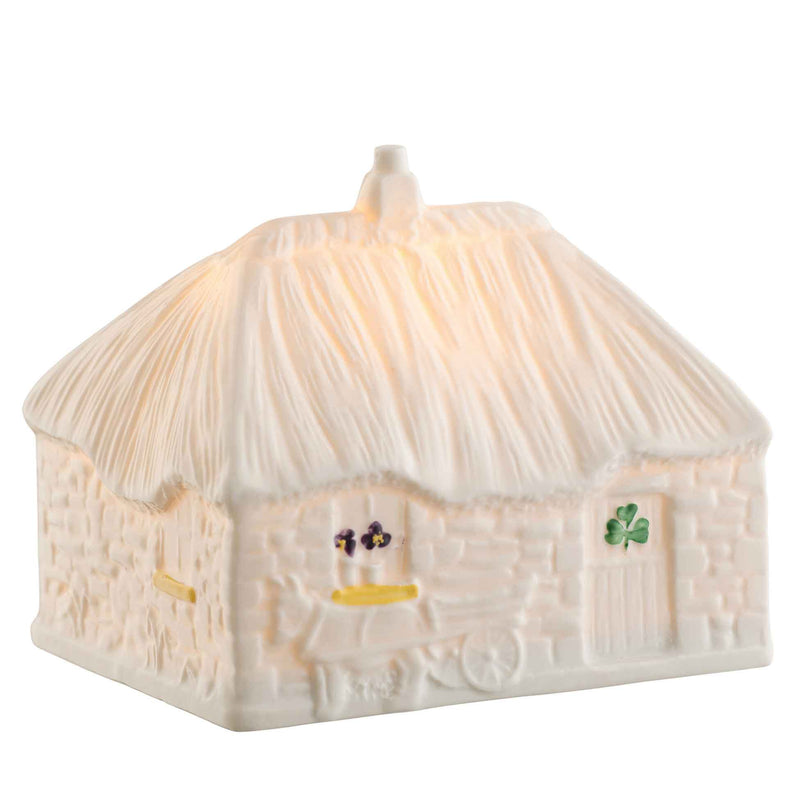 2025 LED Irish Thatched Cottage A Cottage-shaped night light with shamrock design, with details like a donkey and cart and shamrocks.