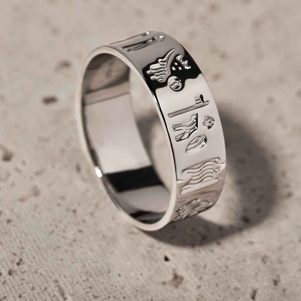 sterling silver history of ireland ring on a textured beige background