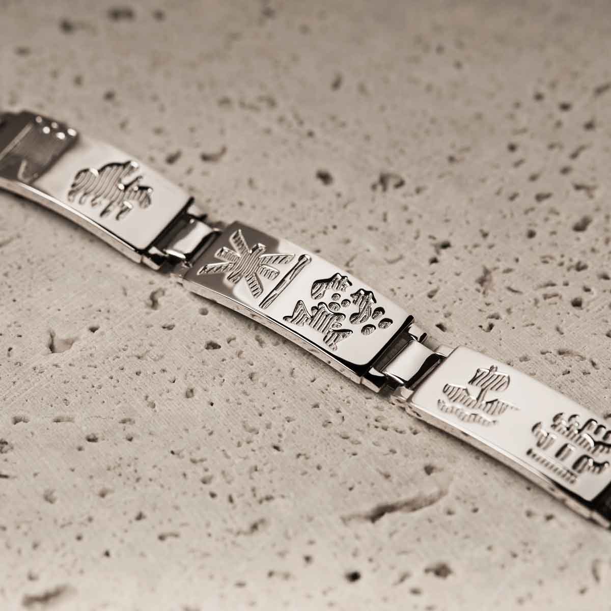 history of ireland sterling silver bracelet with engraved designs on a textured surface