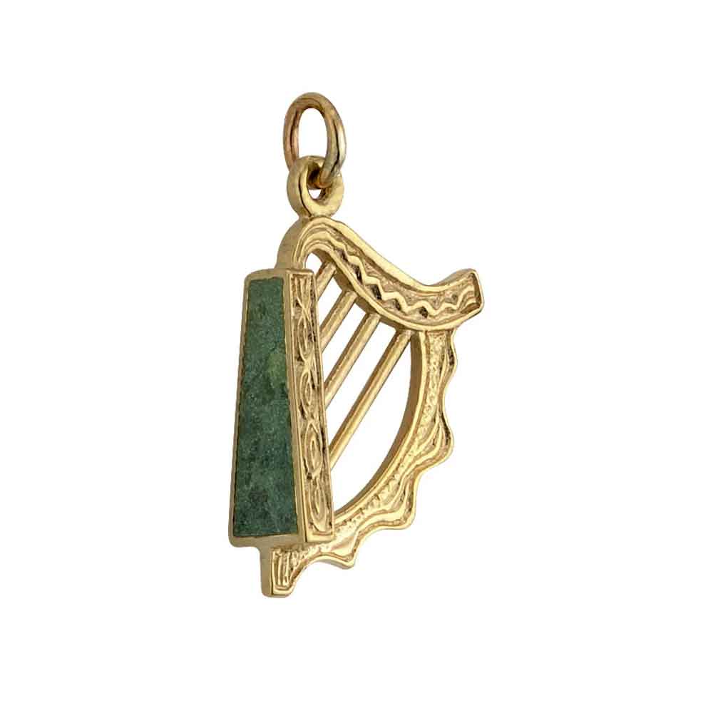 a 14k gold harp charm with connemara marble on a white background