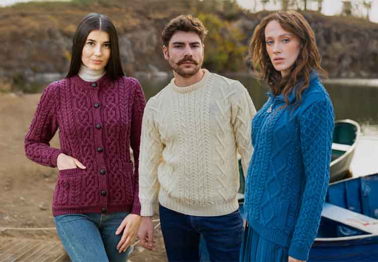 Three people wearing Irish Aran Knitwear in Red, White & Blue colors. Up to 60% OFF SALE. Shop Now
