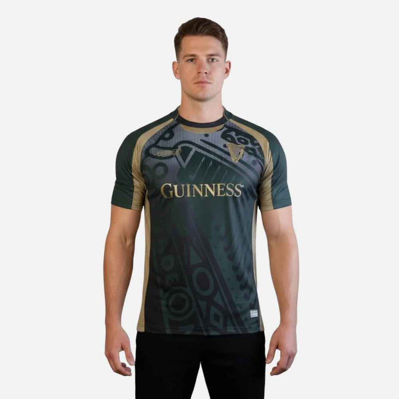 Man wearing a Guinness® Retro Harp Performance Soccer Jersey on a white background