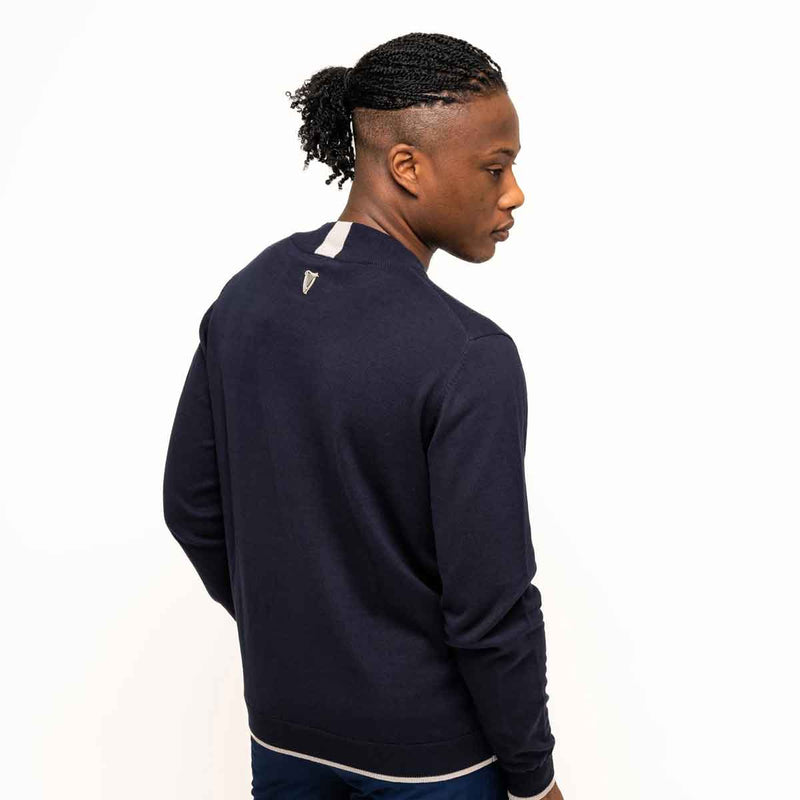 Reverse view of a model wearing a Guinness® Navy Performance Cotton Sweater on a white background
