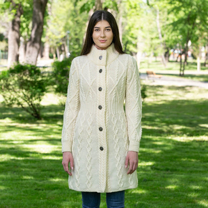 Model wearing the Merino Wool Aran Cable Knit Signature Ladies Jacket in color Natural