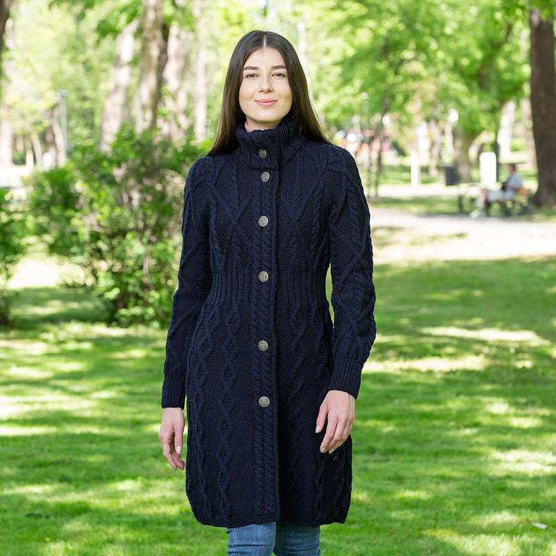 Model wearing the Merino Wool Aran Cable Knit Signature Ladies Jacket in color Navy