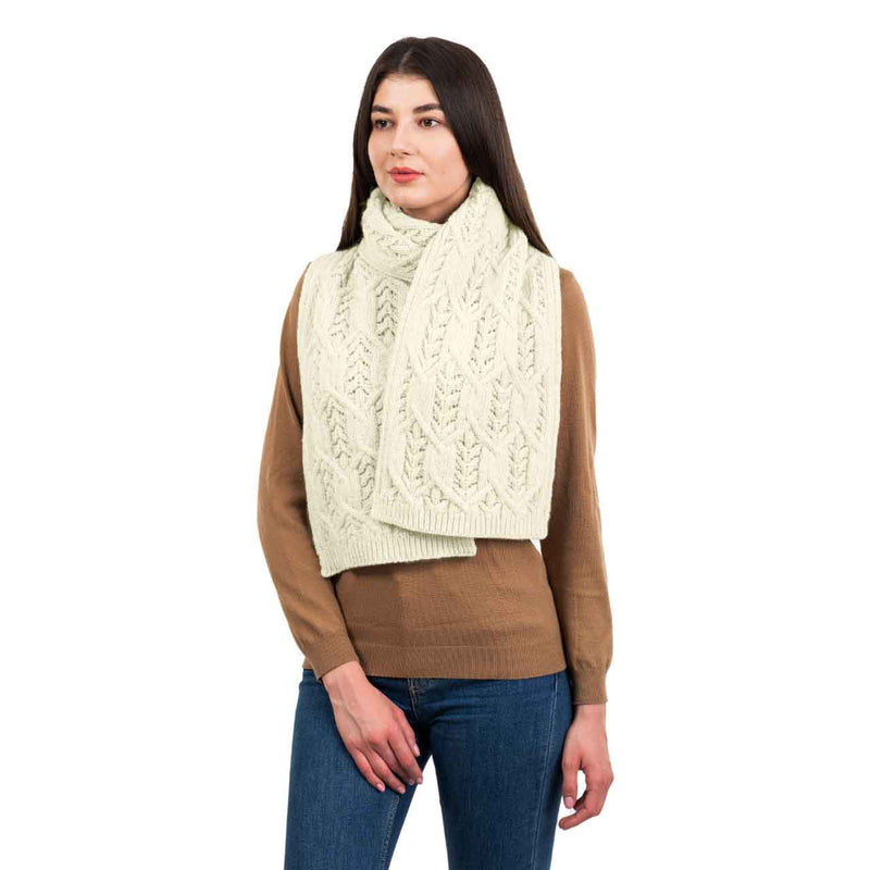 Woman wearing a natural colored Merino Aran Knit Leaf Ladies Scarf
scarf on a white background