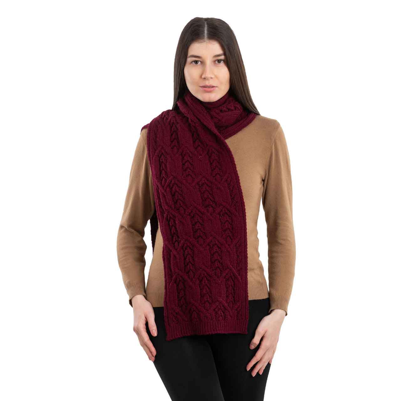 woman wearing a wine colored merino aran knit leaf ladies scarf
scarf on a white background