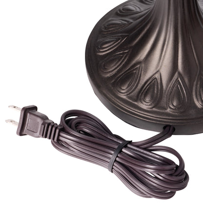 Decorative light fixture with a coiled brown power cord on a white background