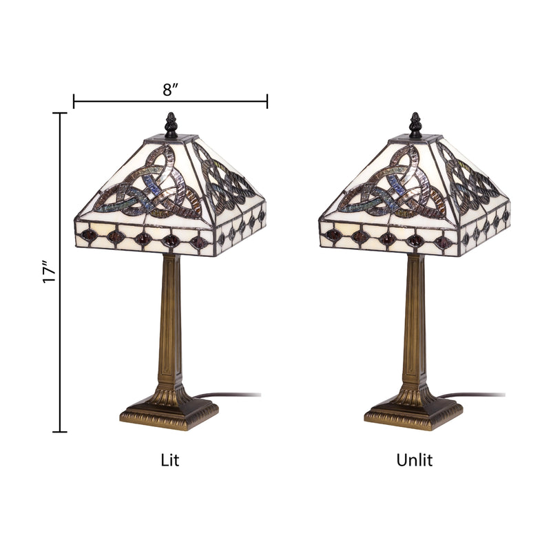 Two views of Celtic Trinity Knot Stained Glass Table Lamp on a white background, one labeled 'Lit' and one labeled 'Unlit', with dimension lines showing 8 inches wide and 17 inches tall. 