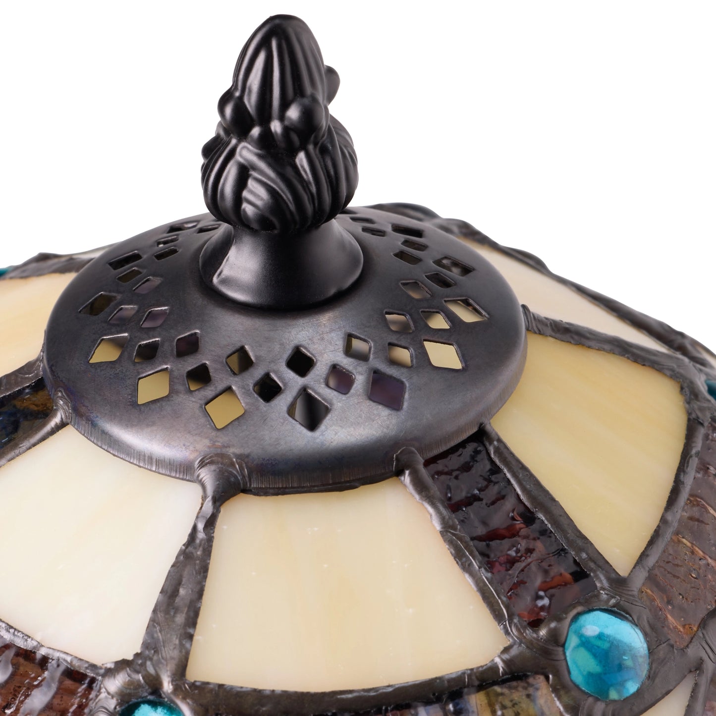 closeup of a celtic stained glass amber pathway table lamp with dark ornate filial and turquoise accents on a white background
