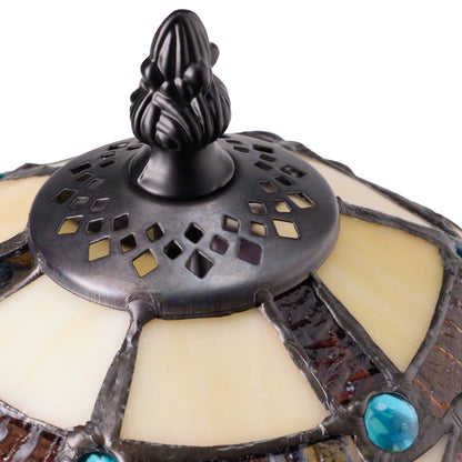Closeup of a Celtic Stained Glass Amber Pathway Table Lamp with dark ornate filial and turquoise accents on a white background