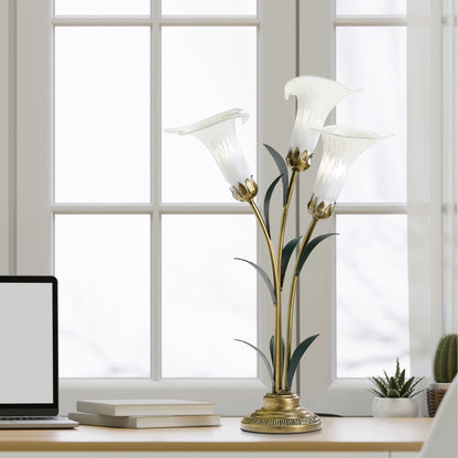 Handblown Glass 3 Light White Lily Table Lamp on a desk in a bright room.