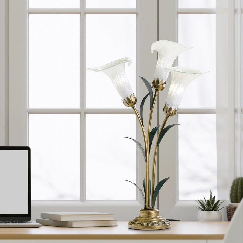 Handblown Glass 3 Light White Lily Table Lamp on a desk in a bright room.