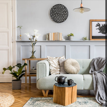 Handblown Glass 3 Light White Lily Table Lamp on a table beside a sofa in a modern interior