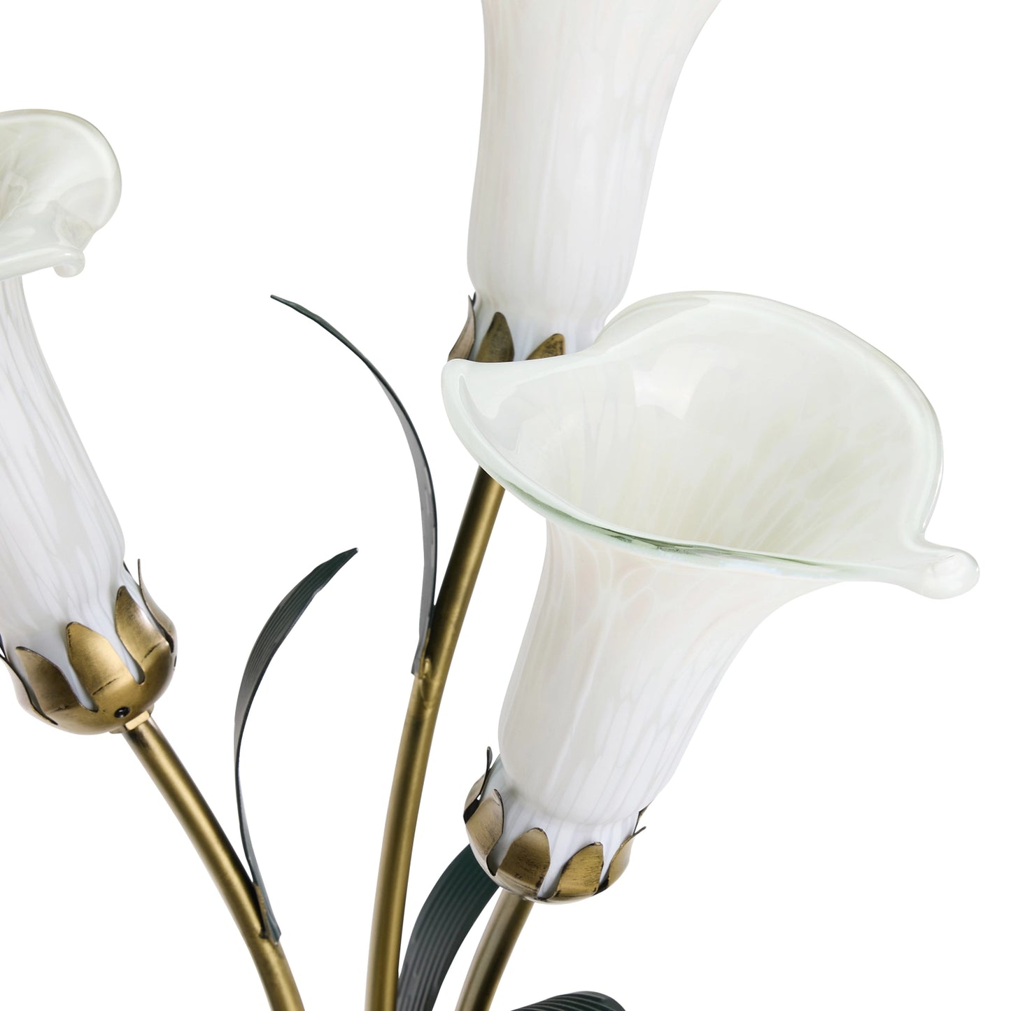 a close-up of handblown glass 3 light white lily table lamp with gold stems and dark green leaves on a plain white background.