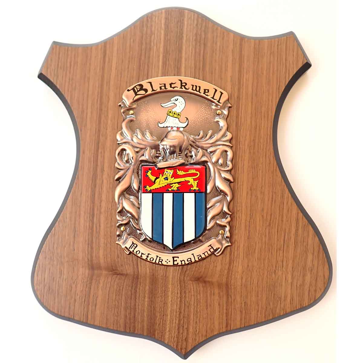 coat of arms | hand painted plaque medium : a painted family crest and motto for the name blackwell, mounted on a wooden shield base, on a white background