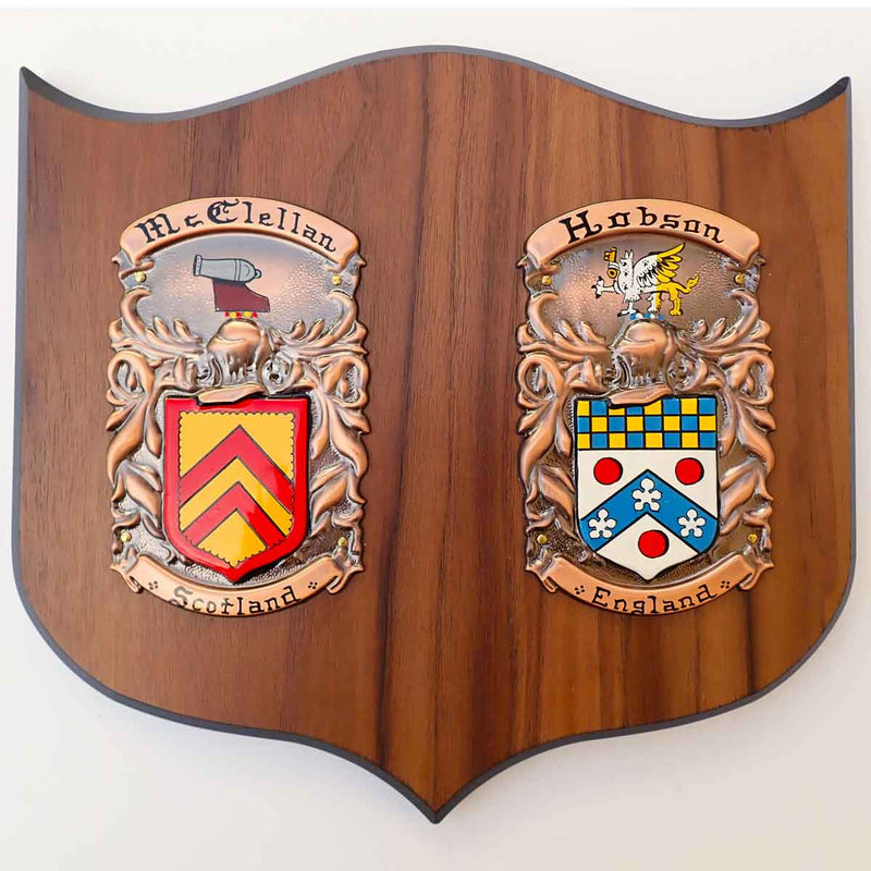 Coat of Arms | Hand Painted Double Plaque Medium: Two painted family crests mounted on a wooden shield base, on a white background