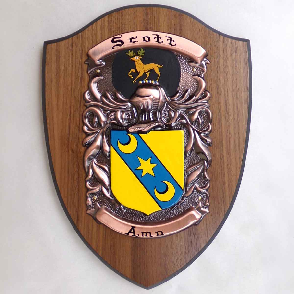 coat of arms | hand painted plaque large: a painted family crest and motto for the name scott, mounted on a wooden shield base, on a white background