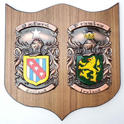 Coat of Arms | Hand Painted Double Plaque Large: Two painted family crests one from England and one from Ireland, mounted on a wooden shield base, on a white background