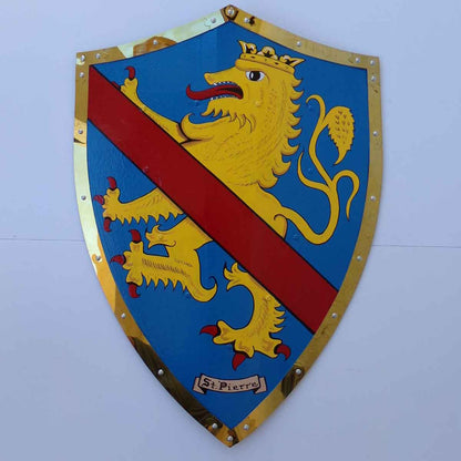 Hand Painted Coat of Arms Battle Shield with the St. Pierre family arms mounted on a white wall