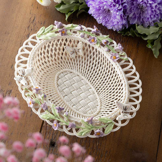 Belleek Pottery Irish Flax Annual Basket Limited Edition 2026 with floral embellishments on a wooden surface