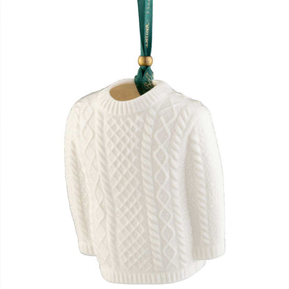 Belleek Pottery Aran Jumper Christmas Ornament, from a green ribbon on a white background.