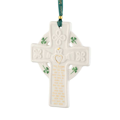 Irish Christmas Belleek Pottery Claddagh Blessing Cross Ornament hanging from a green ribbon on a white background