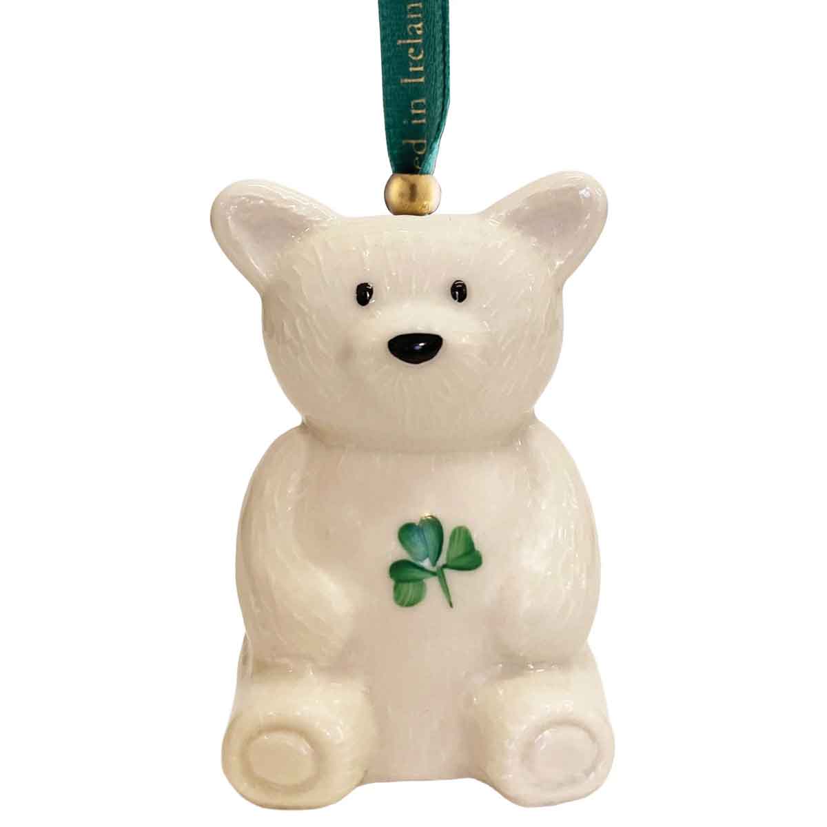 belleek pottery teddy bear hanging ornament with green ribbon on white background