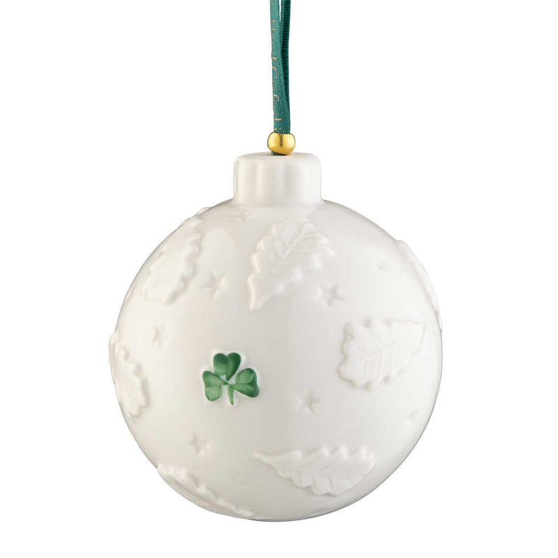 Reverse side of the Belleek Pottery Celtic Tree of Life Bauble with a hand painted green shamrock hanging from a green ribbon on a white background 