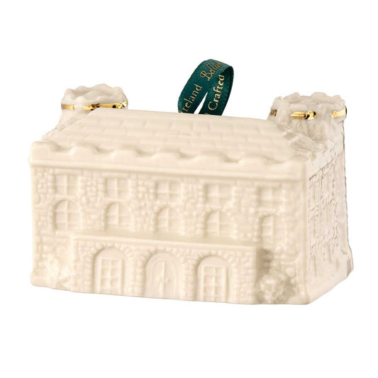 Reverse view of the Kilkenny Castle Belleek Pottery Annual Irish Christmas Ornament 2026 with a green ribbon on a white background.