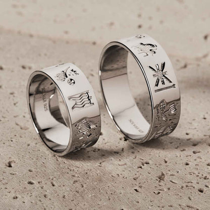 Sterling Silver History of Ireland Rings side-by-side on a textured beige background