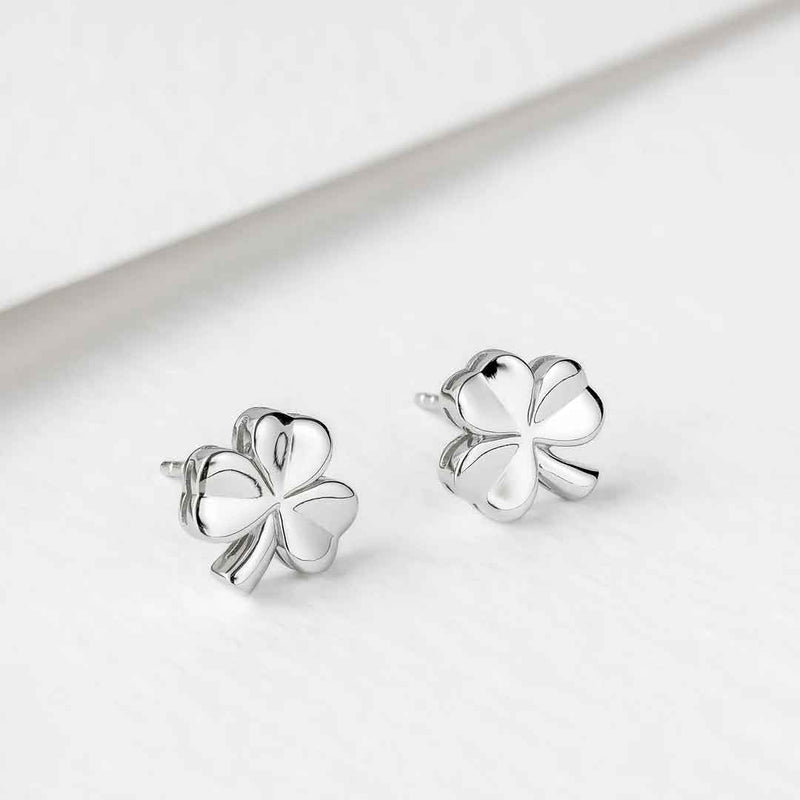 Sterling Silver Shiny Stud Shamrock Earrings on a light gray background