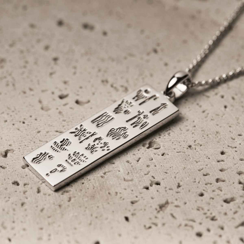 Sterling Silver History of Ireland Ingot  on a textured surface