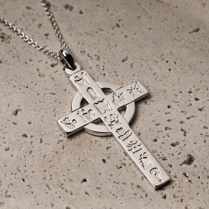 Irish Necklace | Sterling Silver History of Ireland Celtic Cross Pendant on a textured surface