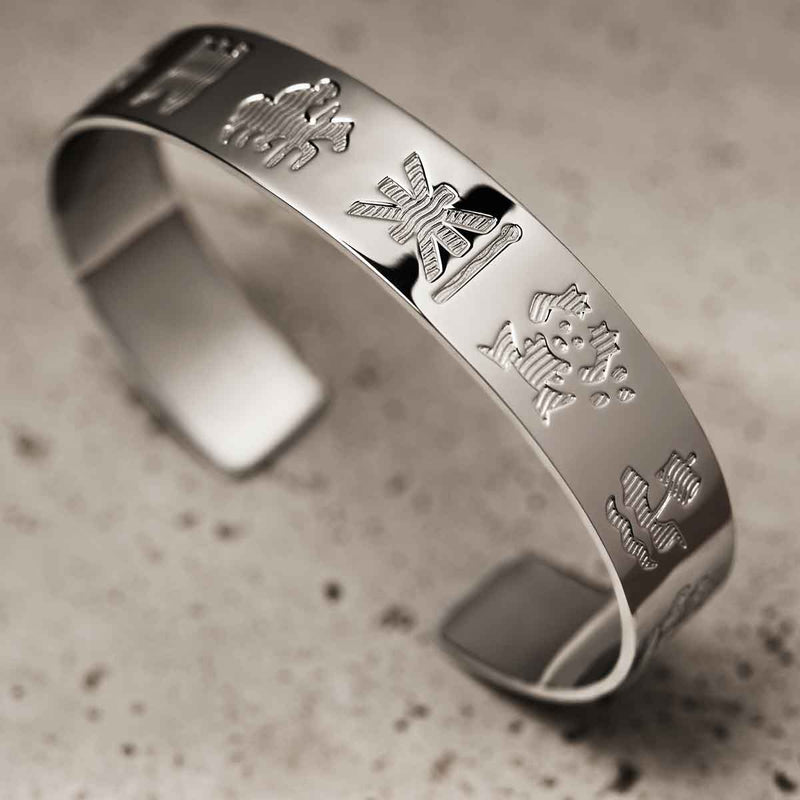 Sterling Silver History of Ireland Bangle on a textured surface