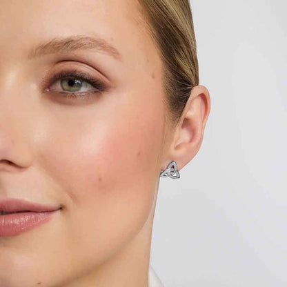 Close up image of aWoman modelling 14k White Gold Trinity Knot Diamond Stud Earrings
