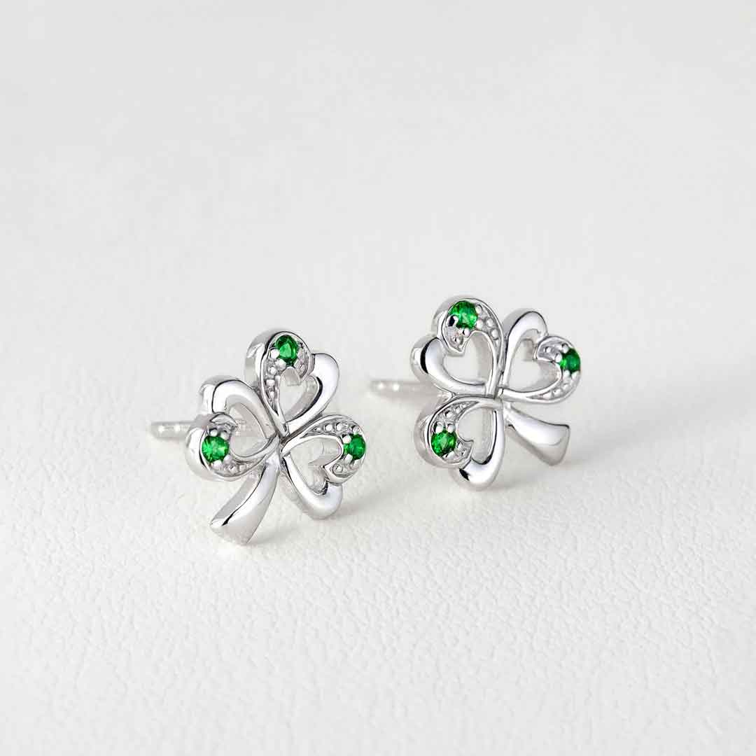 sterling silver shamrock green stone earrings on a white background