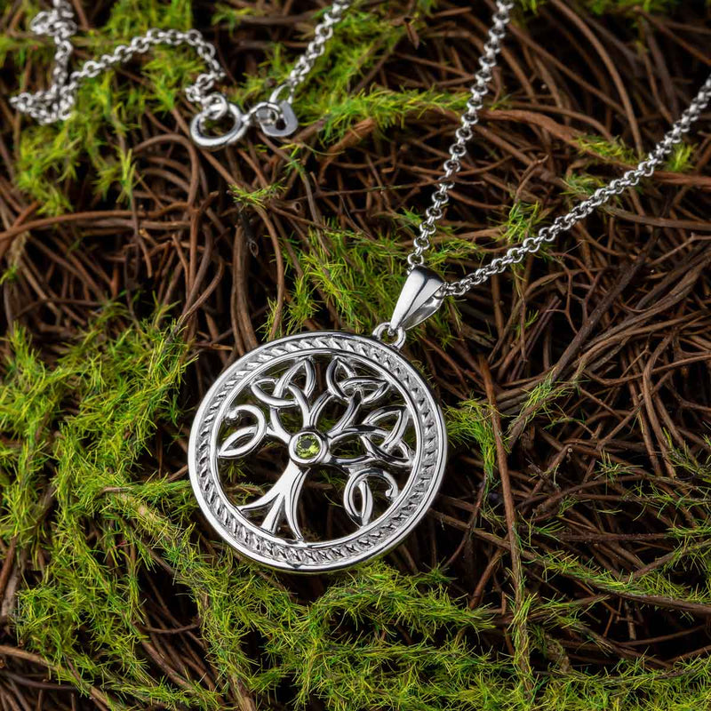 Sterling Silver Tree Of Life Trinity Knot Pendant with Chain on green and brown moss