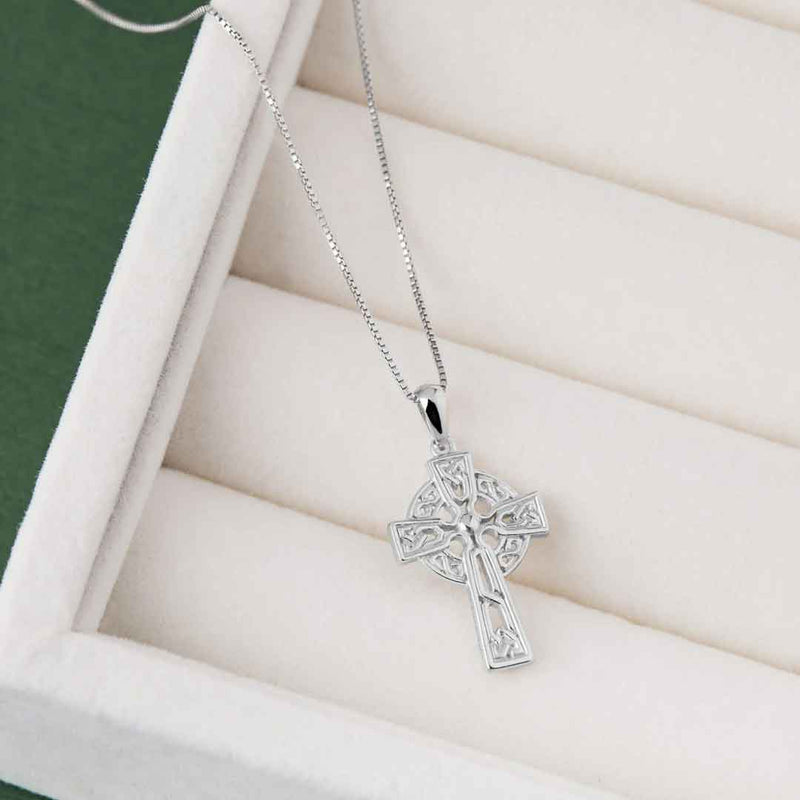 Sterling Silver Filigree Celtic Cross Pendant with Chain on a white surface