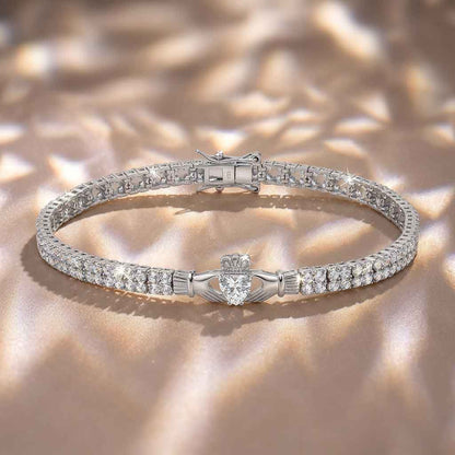 Sterling Silver Multi Set Crystal Claddagh Tennis Bracelet on a textured beige background