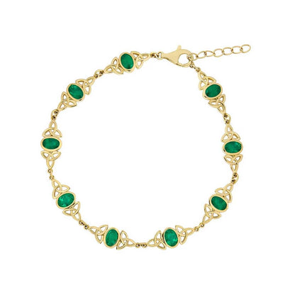 An Irish 14k Gold Emerald Trinity Knot Bracelet on a white background
