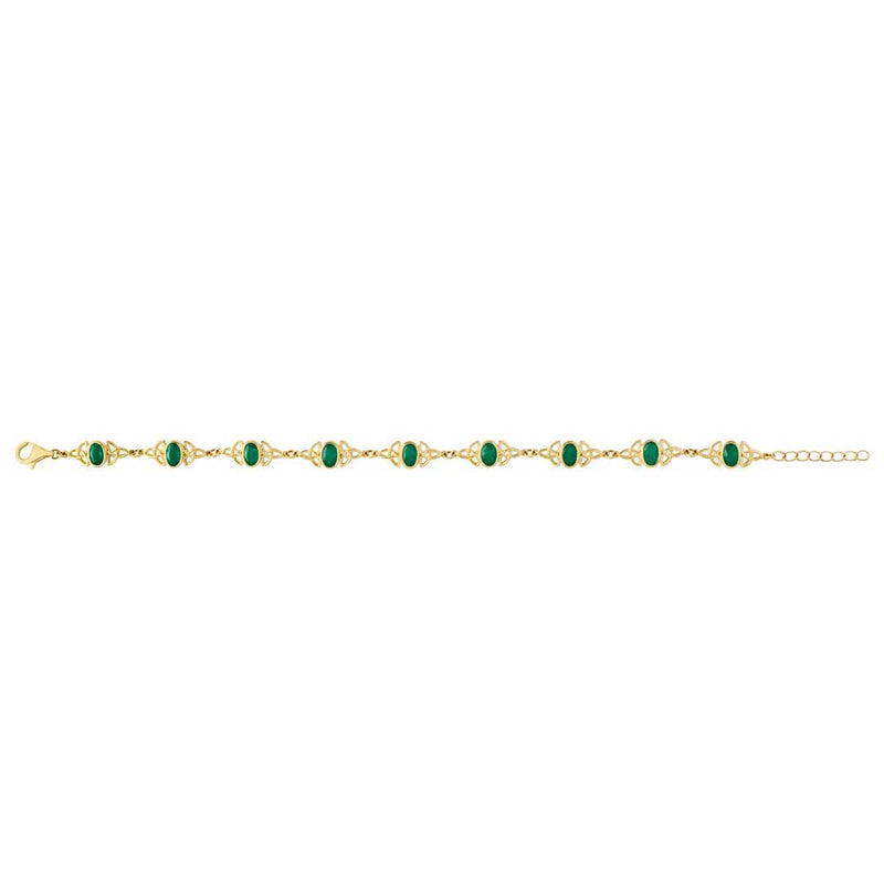 An Irish 14k Gold Emerald Trinity Knot Bracelet , opened, on a plain white background.